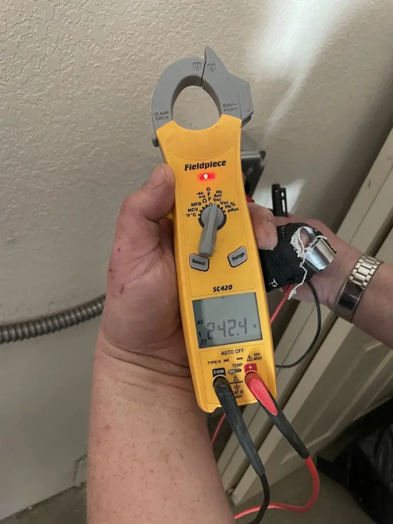Voltage testing with clamp meter during Recessed Lighting Installation in Norwich